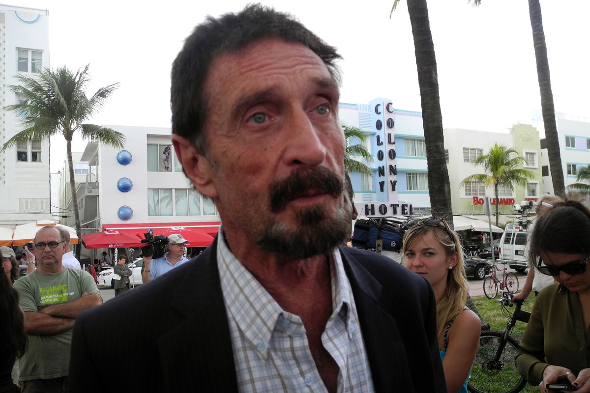 John McAfee in Suit - CryptoSeptic.com